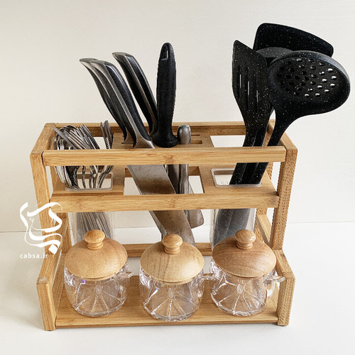 استند آشپزخانه بامبو وارداتی سایز بزرگ با طراحی دوقلو و محفظههای جداگانه برای ابزار آشپزخانه از جنس بامبو طبیعی.