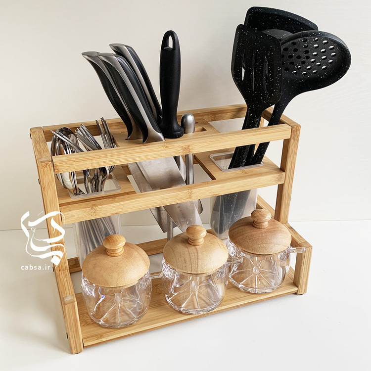 استند آشپزخانه بامبو وارداتی سایز بزرگ با طراحی دوقلو و محفظههای جداگانه برای ابزار آشپزخانه از جنس بامبو طبیعی.