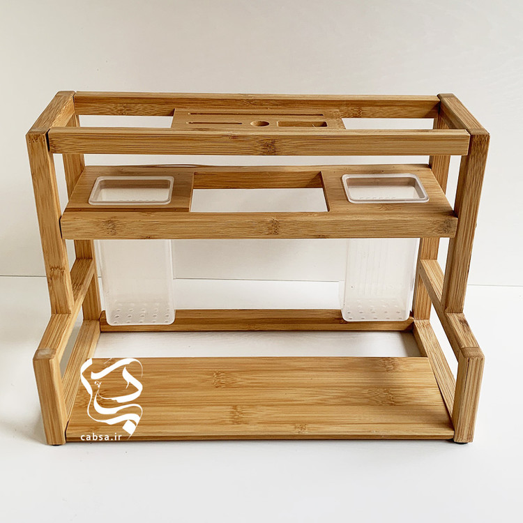 استند آشپزخانه بامبو وارداتی سایز بزرگ با طراحی دوقلو و محفظههای جداگانه برای ابزار آشپزخانه از جنس بامبو طبیعی.