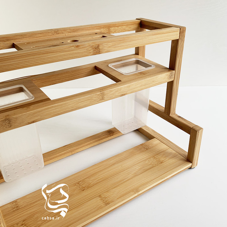 استند آشپزخانه بامبو وارداتی سایز بزرگ با طراحی دوقلو و محفظههای جداگانه برای ابزار آشپزخانه از جنس بامبو طبیعی.