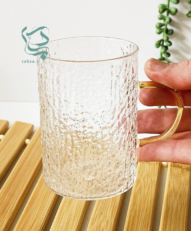 لیوان پیرکس طرح برفی دسته طلایی ماگ شفاف مناسب سرو نوشیدنیهای گرم و سرد