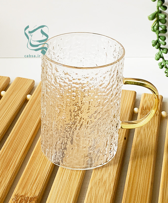 لیوان پیرکس طرح برفی دسته طلایی ماگ شفاف مناسب سرو نوشیدنیهای گرم و سرد