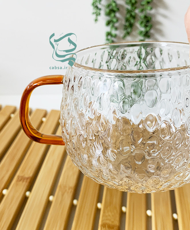 لیوان پیرکس طرح توپی دسته طلایی ماگ شفاف مناسب سرو نوشیدنیهای گرم و سرد
