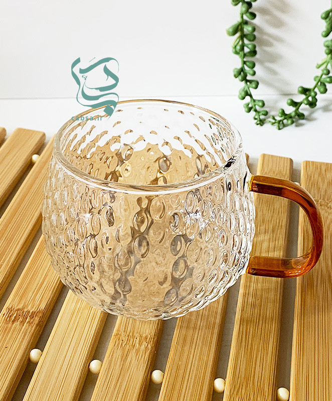 لیوان پیرکس طرح توپی دسته طلایی ماگ شفاف مناسب سرو نوشیدنیهای گرم و سرد