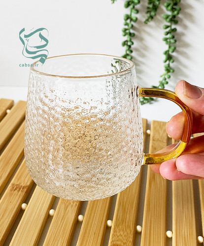 لیوان پیرکس طرح برفی دسته طلایی ماگ شفاف مناسب سرو نوشیدنیهای گرم و سرد