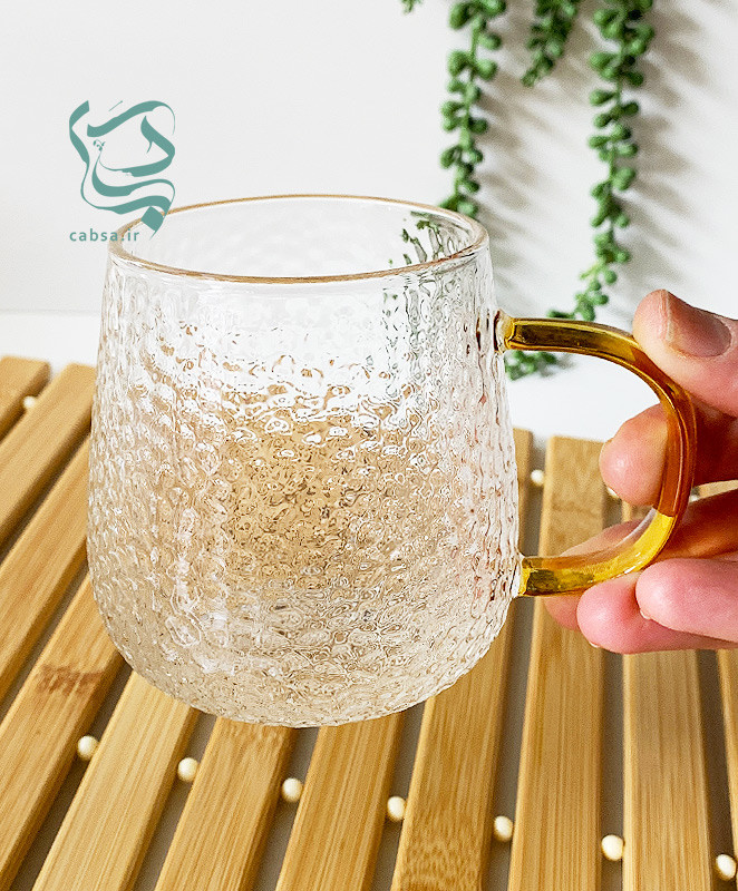 لیوان پیرکس طرح برفی دسته طلایی ماگ شفاف مناسب سرو نوشیدنیهای گرم و سرد