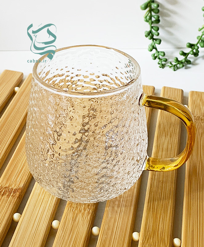 لیوان پیرکس طرح برفی دسته طلایی ماگ شفاف مناسب سرو نوشیدنیهای گرم و سرد