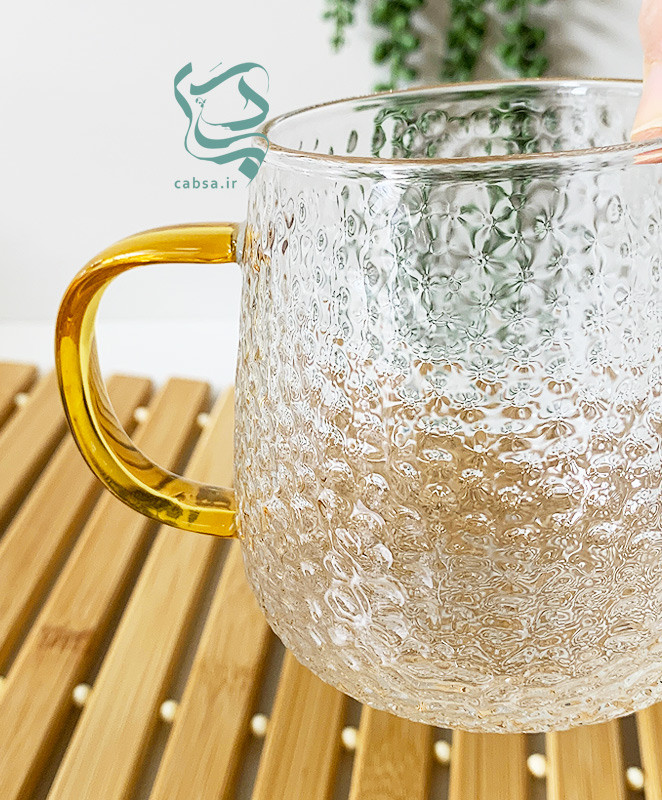 لیوان پیرکس طرح برفی دسته طلایی ماگ شفاف مناسب سرو نوشیدنیهای گرم و سرد